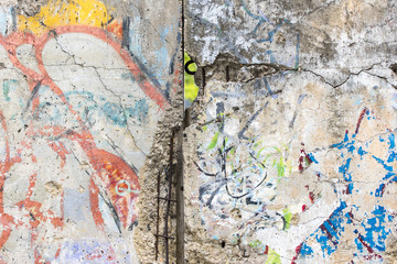 Obraz na płótnie Canvas Close-up part of Berlin Wall. View from the West Berlin side of graffiti art on the Wall