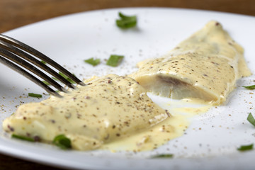Close up of herring fillets in mustard sauce
