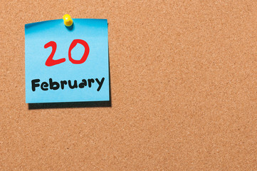 February 20th. Day 20 of month, calendar on cork notice board background. Winter time. Empty space...