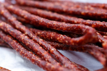 Stick sausages on cooking paper