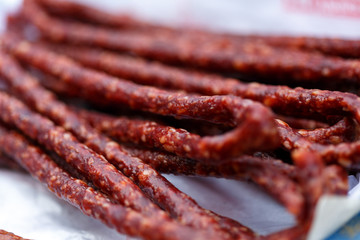 Stick sausages on cooking paper