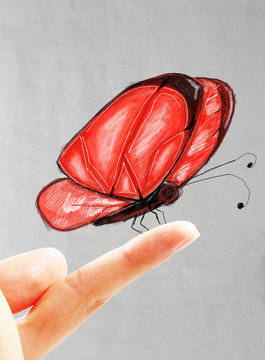 Red Butterfly On Finger