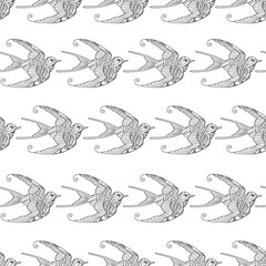 Seamless pattern with ornamental swallow birds hand drawn