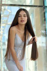 Attractive girl clutched her hair in a fist