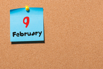 February 9th. Day 9 of month, calendar on cork notice board background. Winter concept. Empty space...