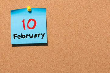 February 10th. Day 10 of month, calendar on cork notice board background. Winter concept. Empty space for text