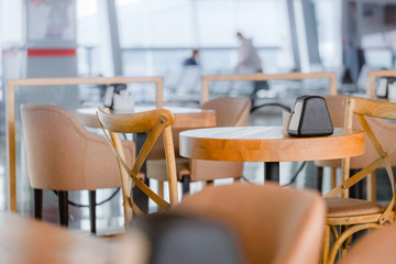 Wooden furniture in airport cafe. Nobody scene.