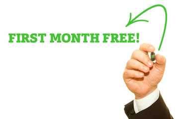 Businessman Hand Writing a message, First Month Free.