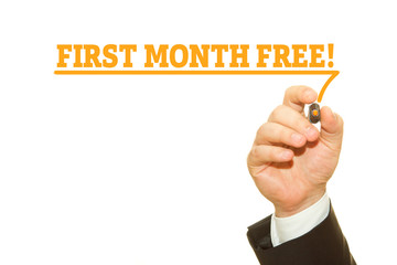 Businessman Hand Writing a message, First Month Free.