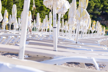Rows of chairs and parasols on beach