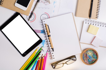 Creative workplace with white tablet
