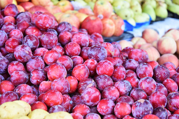 Variety of fresh ripe fruits on street market stall