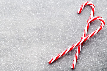 Candy cane. Christmas decors with gray background.