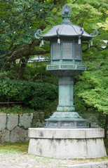 Kyoto, Japan - September 15, 2016: In the garden of the Shinnyo-do Buddhist Temple stand multiple Japanese Lanterns.