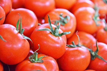 Fresh organic tomatoes on street market stall