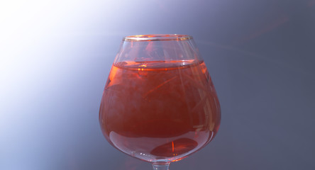 Wine glass filled with red and yellow ink