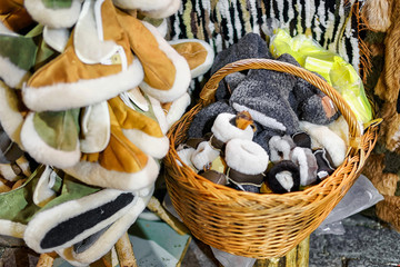 Warm woolen slippers displayed for sale at Riga Christmas market
