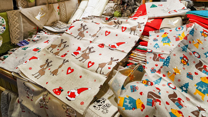 Woman selling festive tablecloths at the Riga Christmas market