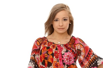 Portrait of young woman in colorful blouse