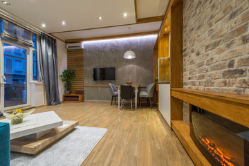 Interior design of modern dining room with sofa