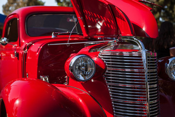 Obraz na płótnie Canvas Part of a red vintage old car with headlamp