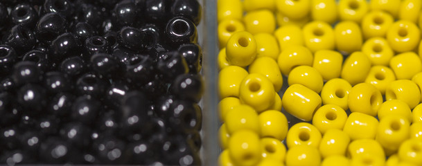 Lots of colorful fusible plastic beads used for arts and craft 