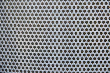 Perforated silver metal background