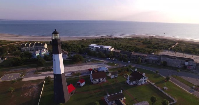 Aerial perspective of the Tybee Island Light Station Lighthouse, flying over the tower.
