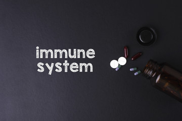 Immunce system word with medicine and bottle - Health concept. 