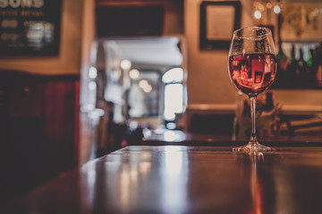Wine glass on a bar table