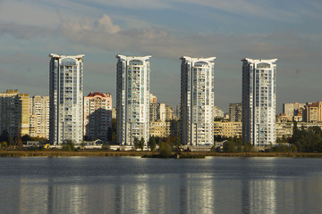 skyscraper on the bank of the lake
