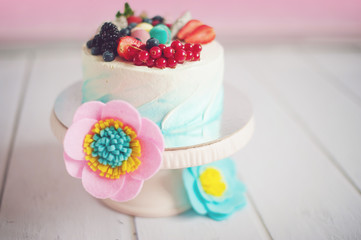 Obraz na płótnie Canvas Vintage cake stand with dessert fresh blackberries and raspberries.