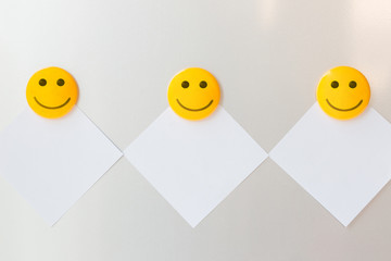 smile yellow magnet paper clip on paper note