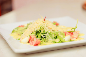 salad with eggs, tomatoes, chicken and cheese