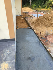 The construction of a cement floor house.
