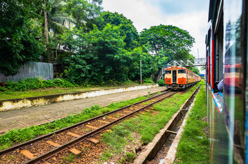 Naklejka premium Train station in Yangon and waiting passengers. Yangon Circular Railway is the local rail . Transportation in Myanmar.