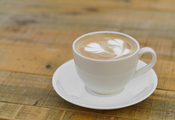 Latte Coffee art on the wooden table