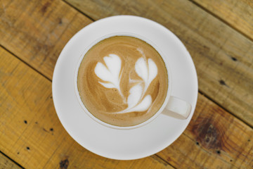 Latte Coffee art on the wooden table