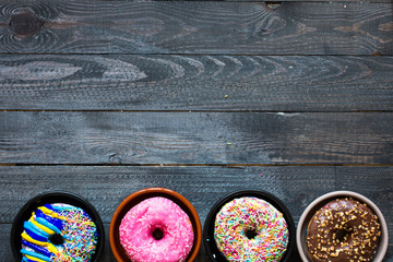 Colorful Donuts breakfast composition with different color styles