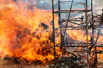 Chinese ceremony burn gold paper and useful things to ancestor.