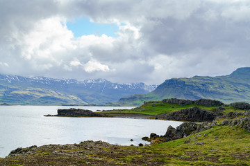 View of fjord and rain clouds