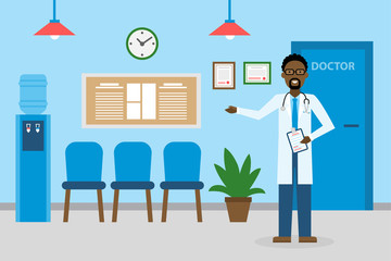 Doctor in waiting room. Handsome smiling african american man in white standing in waiting room. Hospital interior with chairs and health care information.