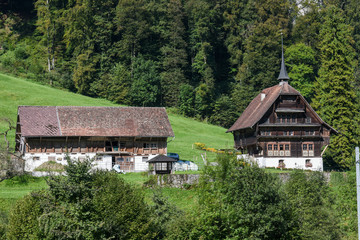 Obraz premium Rural view of a farm with beautiful house at Wolfenschiessen