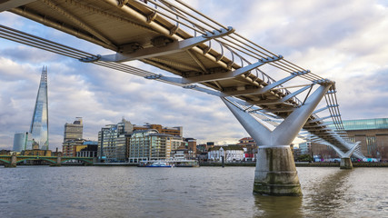Fototapeta premium Millennium Bridge on River Thames with beautiful blue sky and clouds - London, UK