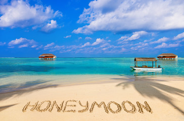 Word Honeymoon on beach - 123306802