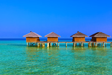 Bungalows on tropical Maldives island