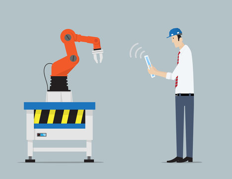 Industry 4.0 Factory Automation Concept. Robot hands controlled by engineer with Tablet PC. .