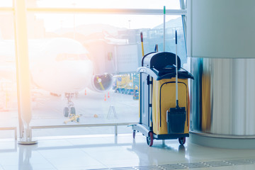 mop bucket and set of cleaning equipment in the airport