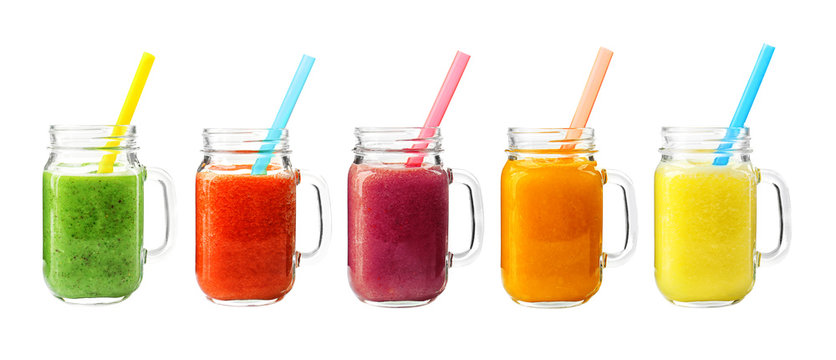 Collage of glass jars with fresh delicious smoothie and straw on white background
