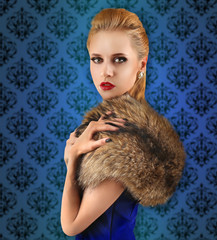 Elegant woman in fur cape on vintage pattern background. Luxury lifestyle.